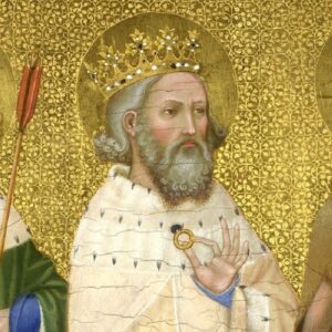 Edward the Confessor drawn on a gold patterned background with a gold crown on his head. He is wearing a white robe and holding a gold ring between his thumb and forefinger which is held up to his chest. 